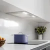 A modern kitchen scene with a purple pot on an induction stove. Voir les images du produit