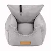 A gray corduroy dog car seat is shown against a white background. Produktbild-Vorschau