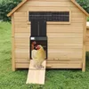 A chicken coop with an automatic door opener, featuring two chickens. Produktbild-Vorschau