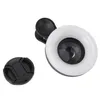 A close-up studio shot of a clip-on ring light for a phone camera, with a lens cap next to it. Produktbild-Vorschau