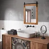 A modern bathroom vanity with a wooden cabinet, a white sink, and a rustic wooden mirror. Náhled obrázku produktu