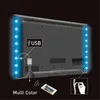 The back of a television with LED RGB light strips attached to the edges, powered by a USB connection. A remote control is shown for color selection. Náhľad obrázku produktu