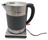 A Bosch electric kettle on its charging base, isolated on a white background. Podgląd zdjęcia produktu