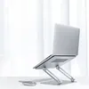 A silver laptop stand with a laptop, keyboard, and mouse on a white surface in front of a white curtain. Náhled obrázku produktu