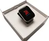 A smartwatch is displayed inside an open white box. Podgląd zdjęcia produktu