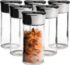 A group of spice jars with one jar filled with spices. Produktbild-Vorschau