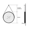 Diagram showing dimensions and adjustable range of a round mirror hanging on a wall. Podgląd zdjęcia produktu