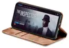 A smartphone in a brown flip case is displayed on a white background. Produktbild-Vorschau