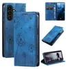 A collage of images showing a blue flip phone case with a dandelion design, including close-ups and the case in use. Produktbild-Vorschau