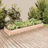 Two wooden raised garden beds filled with plants and flowers are placed on a wooden deck in front of a wall. Produktbild-Vorschau