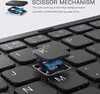Close-up of a keyboard with a key removed to show the scissor mechanism. Produktbild-Vorschau