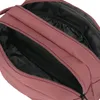 A close-up view of the open compartments of a rose-colored toiletry bag. Náhled obrázku produktu