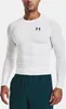 A man wearing a white long-sleeved shirt and teal shorts against a white background. Produktbild-Vorschau