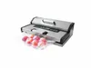 A vacuum sealer machine with a bag of apples sealed inside. Podgląd zdjęcia produktu