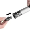 A hand holds a black connector piece, with an arrow pointing towards a silver and black device, indicating assembly. Produktbild-Vorschau