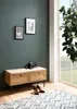 A hallway scene with a bench, shoes, and a plant. Voir les images du produit