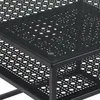 A close-up view of a black metal coffee table with a perforated top and shelf. Produktbild-Vorschau