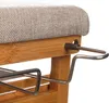 A close-up view of a bamboo ironing board with a gray fabric cover and metal supports. Podgląd zdjęcia produktu