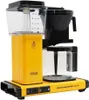 A yellow Moccamaster coffee maker with a glass carafe and water reservoir. Podgląd zdjęcia produktu