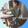 A young boy is painting at a table while sitting in a high chair. Podgląd zdjęcia produktu