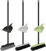 Three brooms with dustpans in different colors. Náhled obrázku produktu