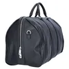 A black Guess weekender bag on a white background. Produktbild-Vorschau