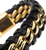 A close-up shot of a black leather bracelet with gold chain links. Produktbild-Vorschau
