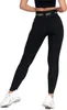 A woman wearing black leggings and white sneakers, shown from the back. Produktbild-Vorschau