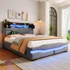 A modern bedroom with a grey upholstered bed featuring LED lighting and a headboard with storage. Náhľad obrázku produktu