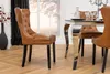 A dining room scene with a table and chairs. Produktbild-Vorschau