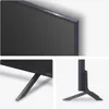 A collage of three close-up images of an LG QNED TV, showing the screen bezel, the stand from the side, and the stand from the front. Produktbild-Vorschau
