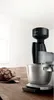 A Bosch stand mixer with a grain mill attachment sits on a wooden table next to a loaf of bread. Anteprima dell’immagine prodotto