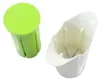A green lid and a white base of a vegetable cutter are shown against a white background. Podgląd zdjęcia produktu