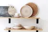 Kitchenware displayed on shelves. Produktbild-Vorschau