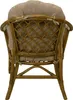 The back view of a rattan armchair with beige cushions. Anteprima dell’immagine prodotto