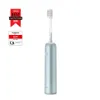 A light blue electric toothbrush is shown vertically against a white background, with awards and certifications to its left. Produktbild-Vorschau