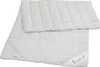 A white quilted duvet or underblanket is shown laid out flat against a white background. Produktbild-Vorschau