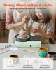 A woman and a child are using a pottery wheel, with art supplies and finished pottery pieces displayed on a table. Produktbild-Vorschau
