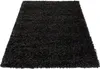 A black shaggy rug is shown from a slightly elevated angle against a white background. Produktbild-Vorschau