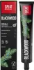 A box and tube of SPLAT Special BLACKWOOD whitening toothpaste with a dark mint flavor, featuring pine branches and berries. Produktbild-Vorschau