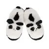 A pair of fluffy panda slippers are shown against a white background. Produktbild-Vorschau