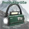 A green multi-functional radio with a flashlight and LED light, shown against a blurred mountain background, with dimensions indicated. Produktbild-Vorschau
