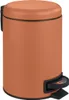 A terracotta colored pedal bin with a black pedal and rim. Náhled obrázku produktu