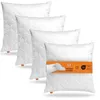 Four white pillows are stacked diagonally on a white background. A band with product information is wrapped around the front pillow. Náhled obrázku produktu