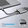 A USB-C adapter connected to a laptop, with cables extending from it. Produktbild-Vorschau