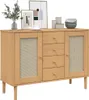 A wooden sideboard with rattan-look doors and drawers, decorated with framed pictures, a plant, and decorative bowls. Náhled obrázku produktu