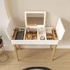A white vanity table with a lighted mirror and various makeup products organized inside its compartments. Produktbild-Vorschau