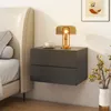 A modern bedroom scene with a wall-mounted nightstand next to a bed. Anteprima dell’immagine prodotto