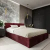 A bedroom with a large bed, nightstand, and wardrobe. Podgląd zdjęcia produktu