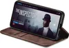 A smartphone in a brown flip case is displayed at an angle, showing a movie streaming interface on its screen. Produktbild-Vorschau